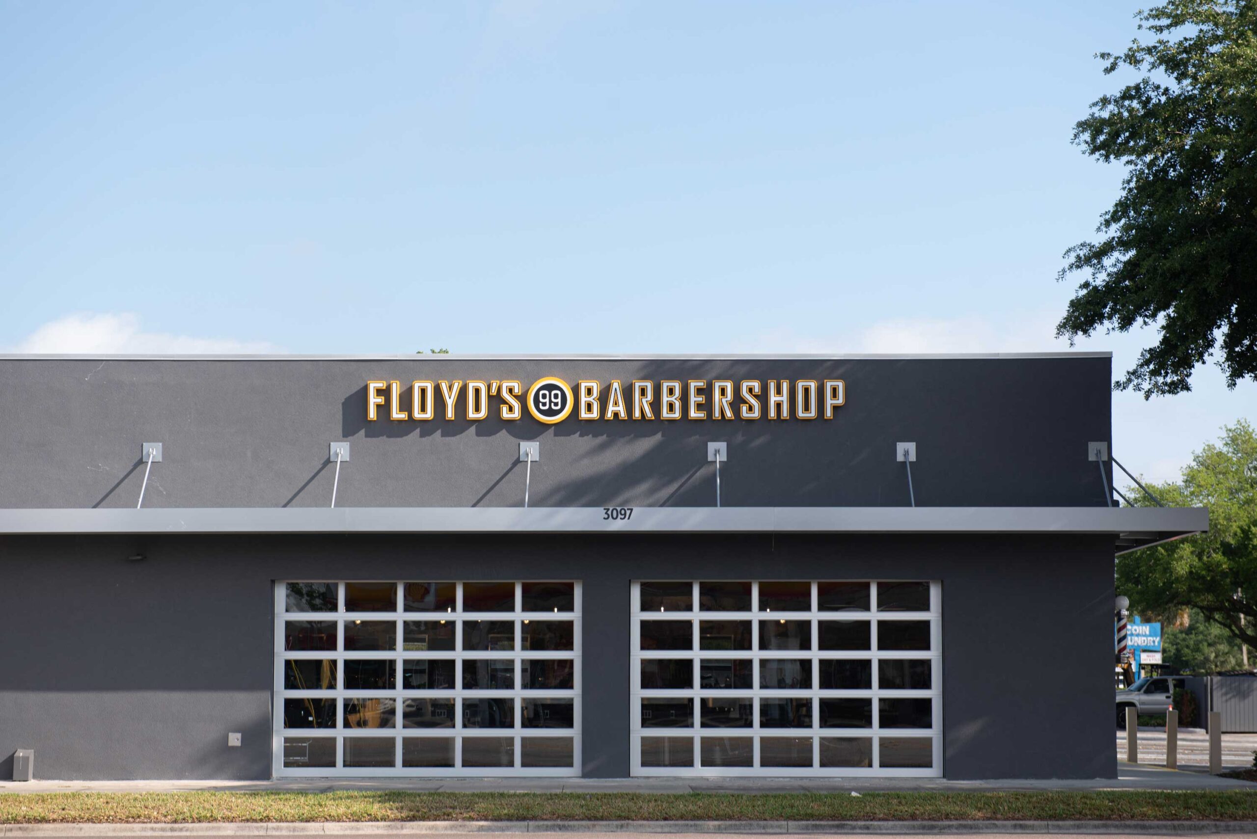Floyd's Barbershop exterior with garage doors closed