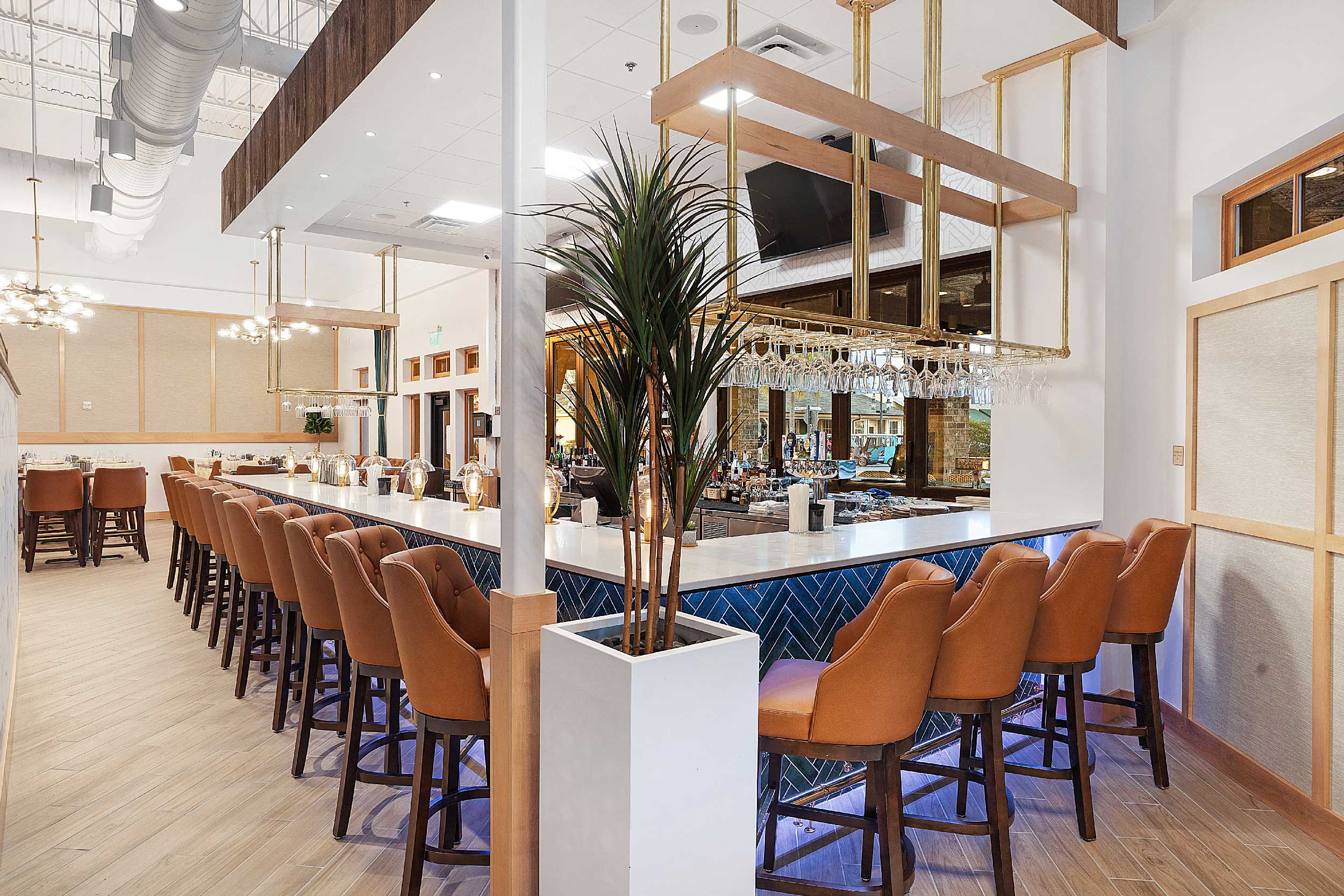 Harvest Restaurant bar area with angled terra cotta-colored bar stools